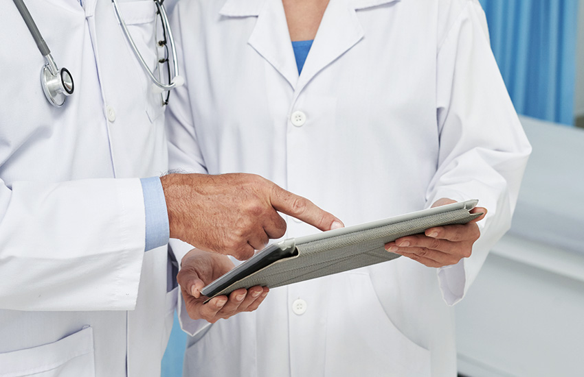 doctor and nurse with tablet